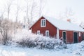 Old wooden red farm house in the winter wonderland Royalty Free Stock Photo