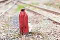 Old Wooden red pillar for warning in the split railroad