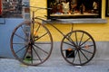 Wooden retro bike in front of a shop