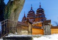 LVIV, UKRAINE - January 31, 2021: Old wooden retro church in the Shevchenko Grove Old village in winter and at night Royalty Free Stock Photo