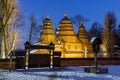 LVIV, UKRAINE - January 31, 2021: Old wooden retro church in the Shevchenko Grove Old village in winter and at night Royalty Free Stock Photo