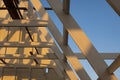 the old wooden roof structure in incomplete house building site against blue sky Royalty Free Stock Photo