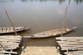 Old wooden row boat and raft on water Royalty Free Stock Photo