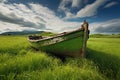 an old, wooden rowboat abandoned in a green field Royalty Free Stock Photo