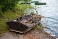 Old wooden rowboat by a lake Royalty Free Stock Photo