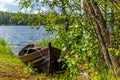 Old wooden rowing boat on the shore of the Saimaa lake in Finland - 1 Royalty Free Stock Photo