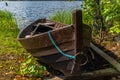 Old wooden rowing boat on the shore of the Saimaa lake in Finland - 5 Royalty Free Stock Photo