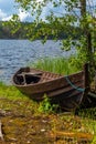 Old wooden rowing boat on the shore of the Saimaa lake in Finland - 3 Royalty Free Stock Photo