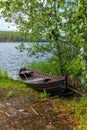 Old wooden rowing boat on the shore of the Saimaa lake in Finland - 12 Royalty Free Stock Photo