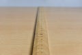 Old wooden ruler on the table Royalty Free Stock Photo