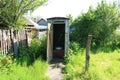 Old wooden rural toilet in summer