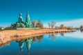 Old Wooden Russian Orthodox Church Near Lake In Early Spring Or Late Autumn Season. Sunny Day Royalty Free Stock Photo