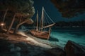 An old wooden sailboat being hauled up onto the shores of a secluded island beach. Rustic boat against a backdrop of turquoise