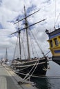 Old wooden sailboats docked in the harbor. Royalty Free Stock Photo