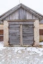 Old Wooden Shed Doors Exterior on White Brick Wall Royalty Free Stock Photo