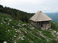 Old wooden sheepfold / cottage / cabin in the mountains Royalty Free Stock Photo
