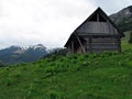 Old wooden sheepfold / cottage / cabin in the mountains Royalty Free Stock Photo