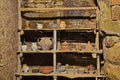 Old wooden shelf with vintage pottery in house of the ancient abandoned village Celleno, Viterbo, Lazio, Italy