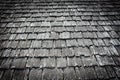 Old wooden shingles on the roof of the house. Toned.