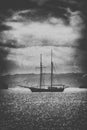 Old wooden ship in the sea under a dramatic sky.Fine art image c Royalty Free Stock Photo