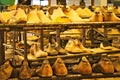 Old wooden shoe lasts on metal shelves