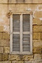 Old wooden shutter in Malta. Royalty Free Stock Photo