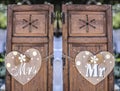 Old wooden shutter windows with hanging hearts for Mrs and Mr Royalty Free Stock Photo
