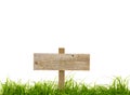 Old wooden sign with green grass Royalty Free Stock Photo