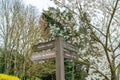 Old wooden sign post with directions Royalty Free Stock Photo