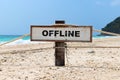 Old wooden sign with text offline on tropical beach