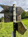 Old wooden signposts on a metal pole