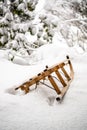 Old wooden sled in deep snow Royalty Free Stock Photo