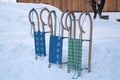 Wooden sledges on snow in winter time