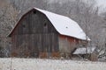 Old wooden snow-covered barn during a winter Royalty Free Stock Photo
