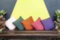 old wooden sofa and multicolored fabric cushions in the living room of the house Royalty Free Stock Photo