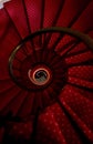 Old spiral red carpet staircase Royalty Free Stock Photo