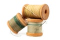 An old wooden spool of thread and a needle on a white background close-up. Threads for sewing Royalty Free Stock Photo