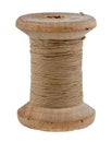 Old wooden spool of thread and needle on a white background. Sewing accessories Royalty Free Stock Photo