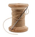 Old wooden spool of thread and needle on a white background. Sewing accessories Royalty Free Stock Photo