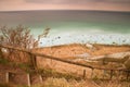 Old wooden stair way down with wooden hadrail, steps down to sea shore hill Royalty Free Stock Photo