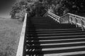 Old wooden staircase in the city park of Chernigov. Way up. Black and white image Royalty Free Stock Photo