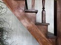 Old wooden stairs and concrete wall with fresh green plants Royalty Free Stock Photo