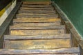 Old wooden stairs, steps and railings, painted walls. Royalty Free Stock Photo