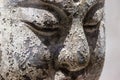 Old wooden statue of buddha closeup