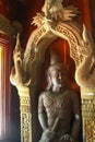 Old wooden statue in a buddhistic temple Royalty Free Stock Photo