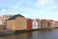 Old Wooden Storehouses Beside the Nidelva River in Trondheim, Norway Royalty Free Stock Photo