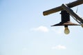 An old wooden street lamp post against the background of the sky during the day in Ukraine in the summer, lighting Royalty Free Stock Photo