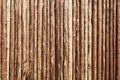 Old wooden surface. Aged natural background. Fence made of tree trunks Royalty Free Stock Photo