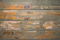 Old wooden surface with peeling varnish and peeling paint. Royalty Free Stock Photo