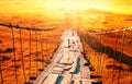 Old wooden suspension bridge with rusty cables and rotten planks. Selective focus. Royalty Free Stock Photo